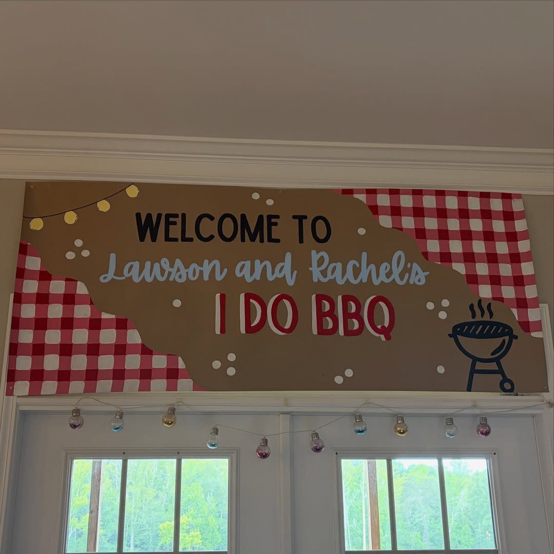 Welcome sign for an I Do BBQ wedding with red checkered accents.