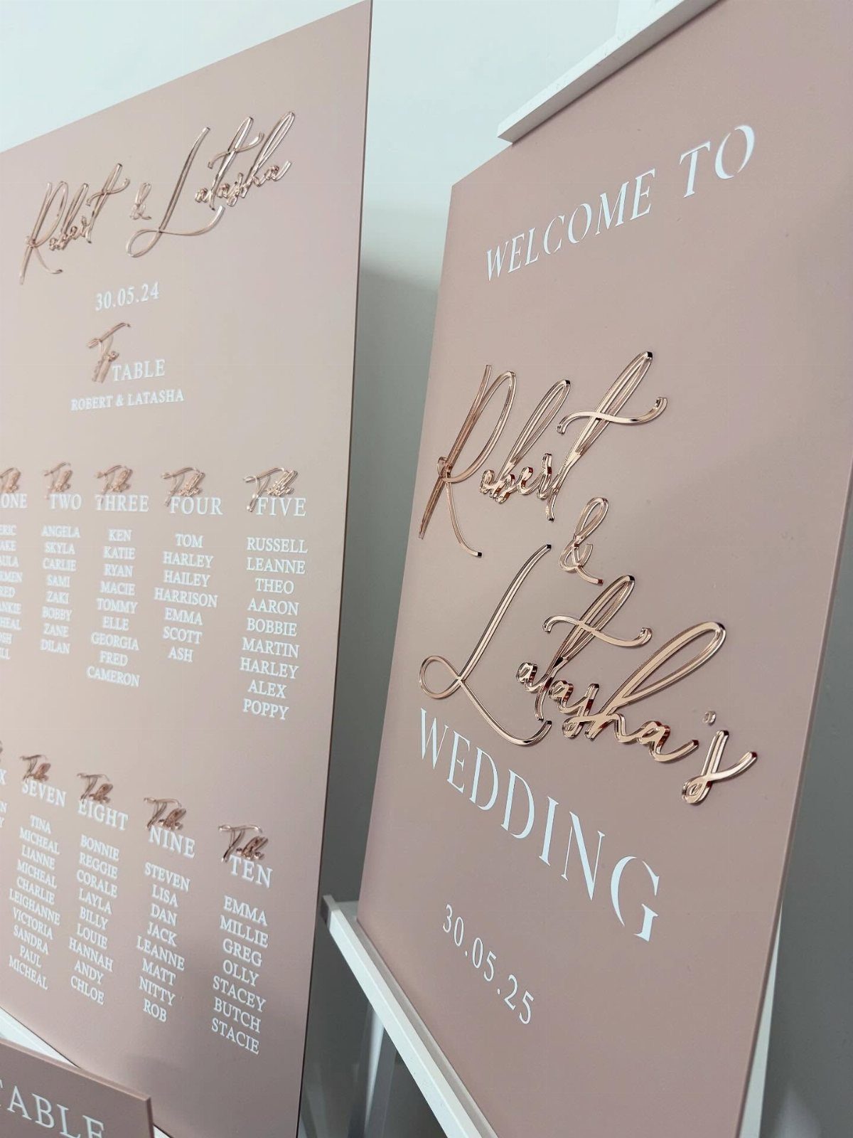 Rose gold wedding welcome sign and seating chart with elegant metallic script lettering