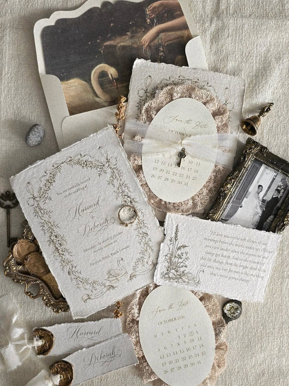 Vintage wedding invitations with lace borders and calligraphy surrounded by antique photographs.