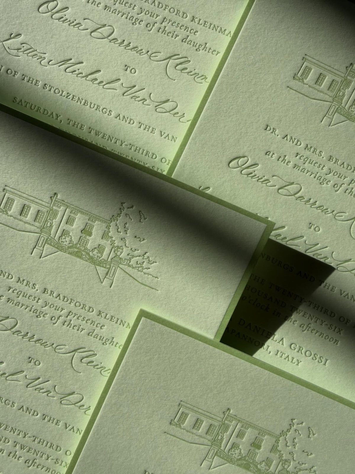 Light green wedding invitations with elegant typography and a building illustration.