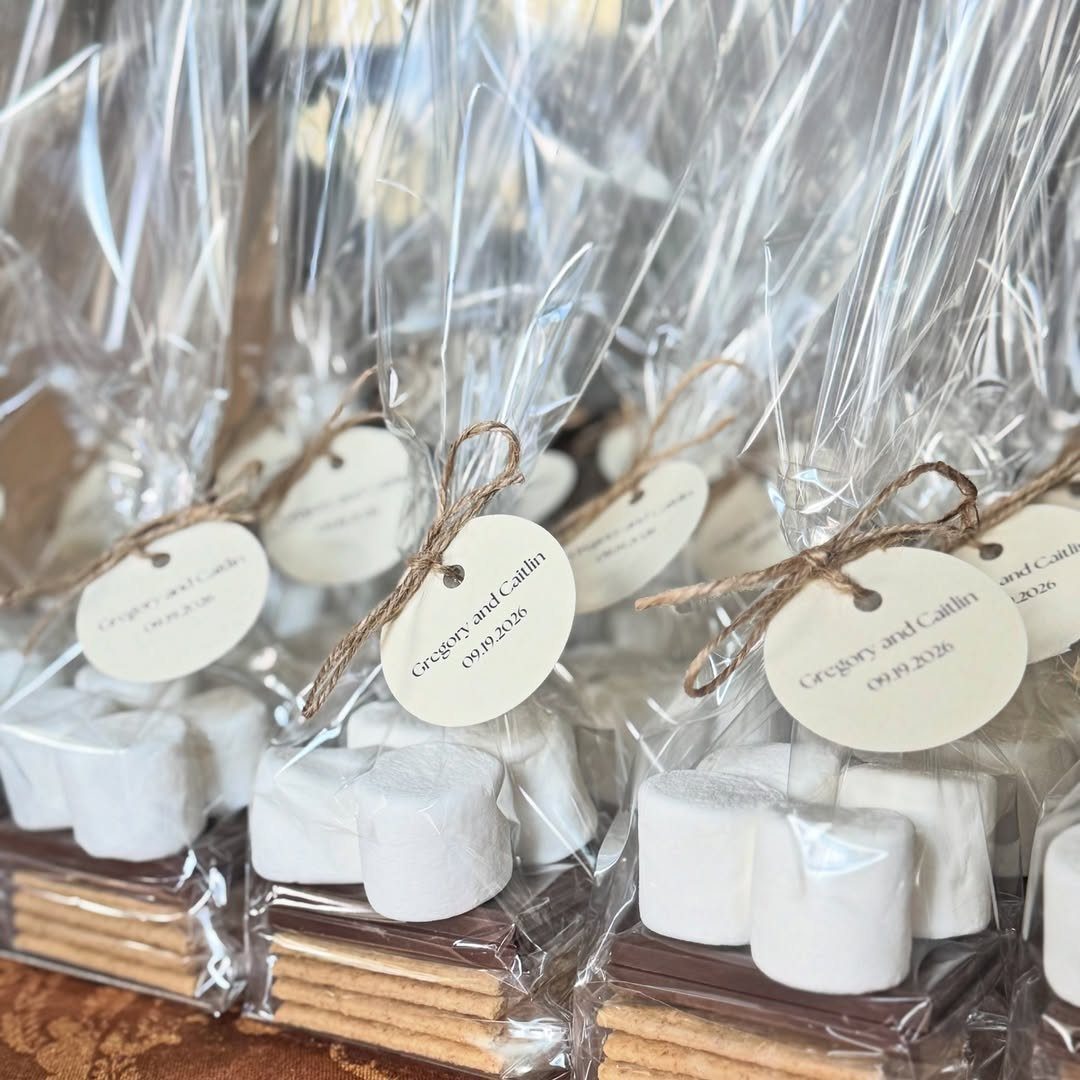 S'mores kits in clear plastic bags with twine and personalized white tags.