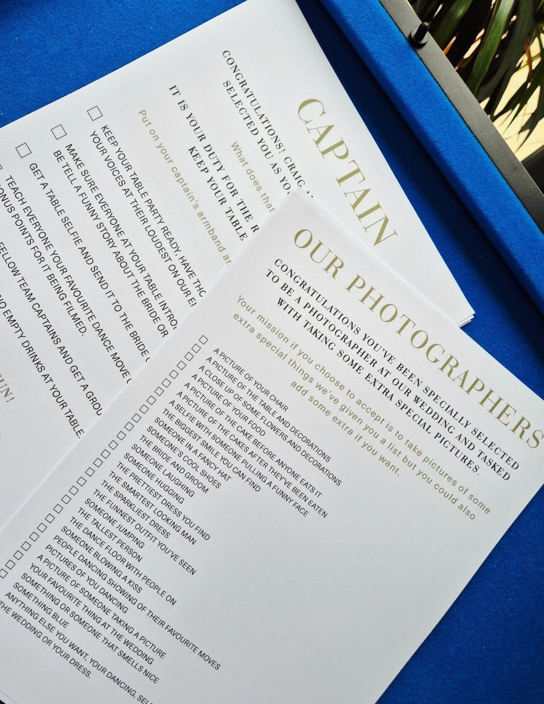 Printed wedding scavenger hunt list with a checklist of photo prompts on white paper.