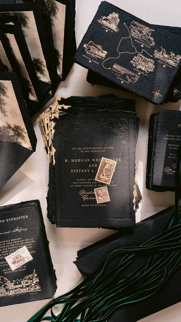 Black wedding invitations with gold foil text and gold leaf deckled edges.